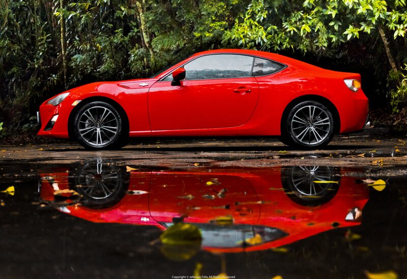 Red Sports Car — Dramatic, Photograph, Puddle, Trees
