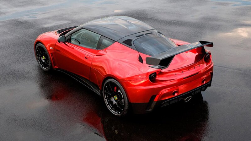 Red Sports Car — Dramatic, Photograph, Wet Pavement, Rear Spoiler