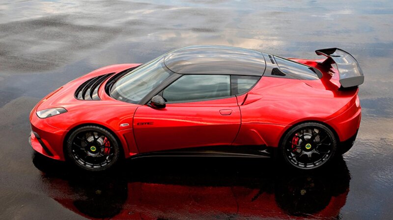 Red Sports Car — Dramatic, Photograph, Wet Surface