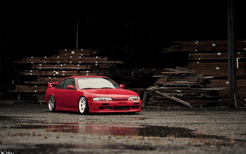 Red Sports Car — Dramatic, Photograph, Wood Stacks