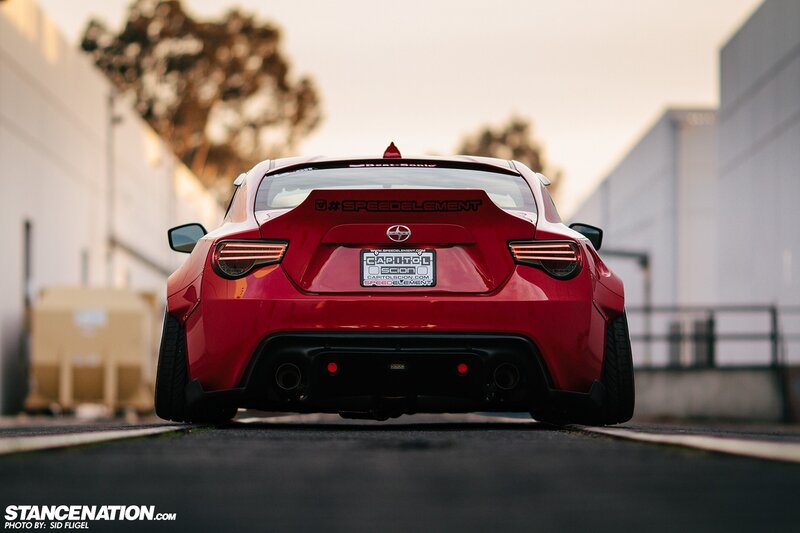 Red Sports Car — Dramatic, Sunset, Photograph, Building, Tree