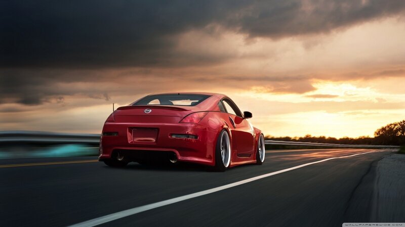 Red Sports Car — Dramatic, Sunset, Photograph, Road, Sky, Guardrail