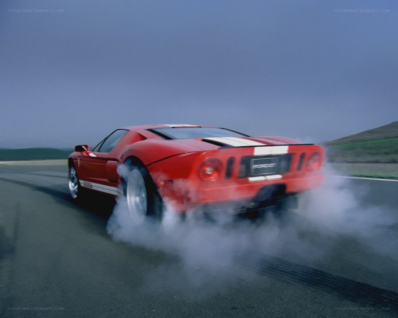 Red sports car drifting