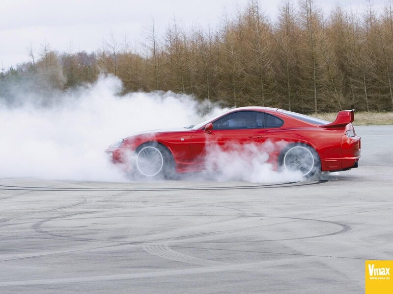 Red sports car drifting