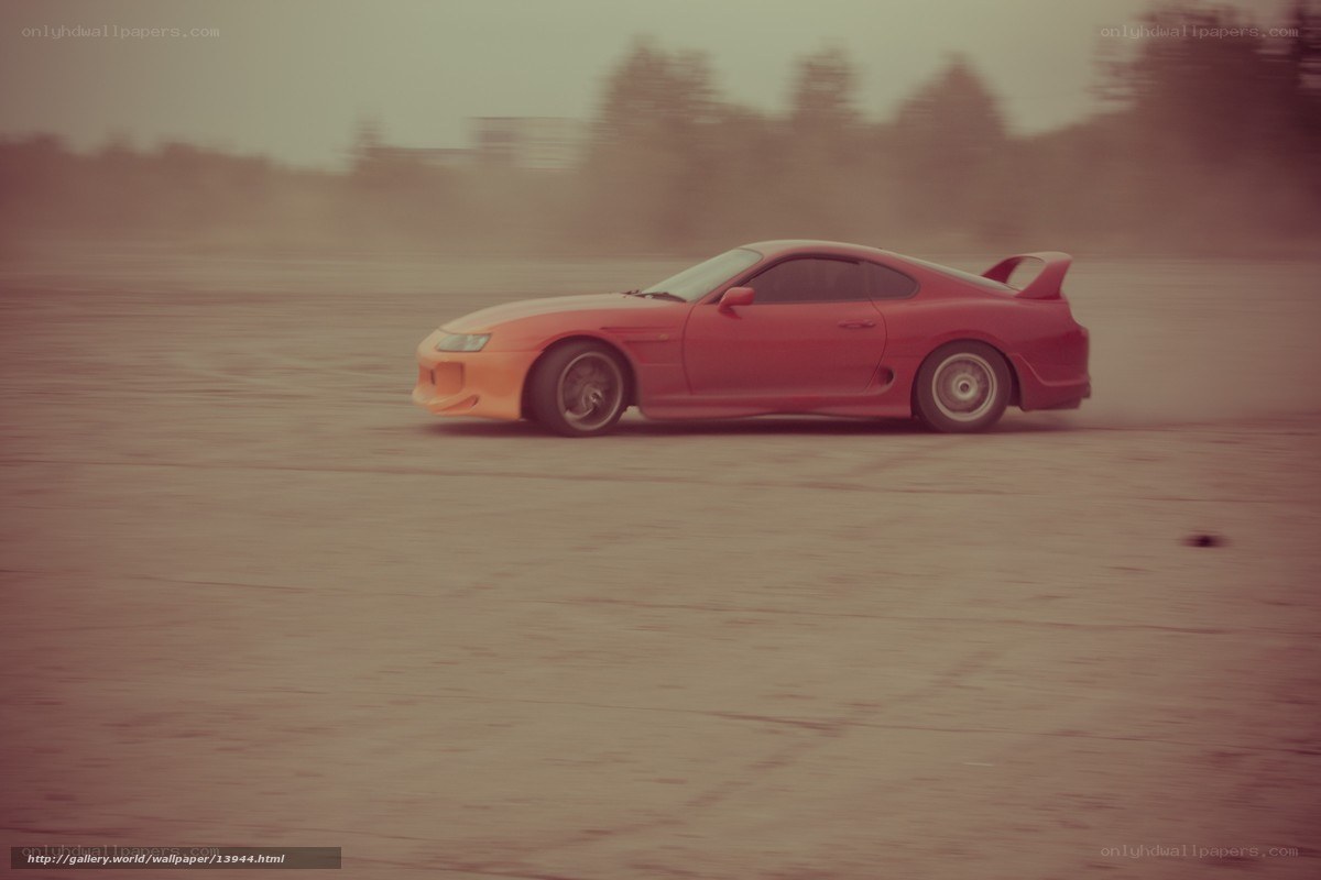 Red sports car drifting
