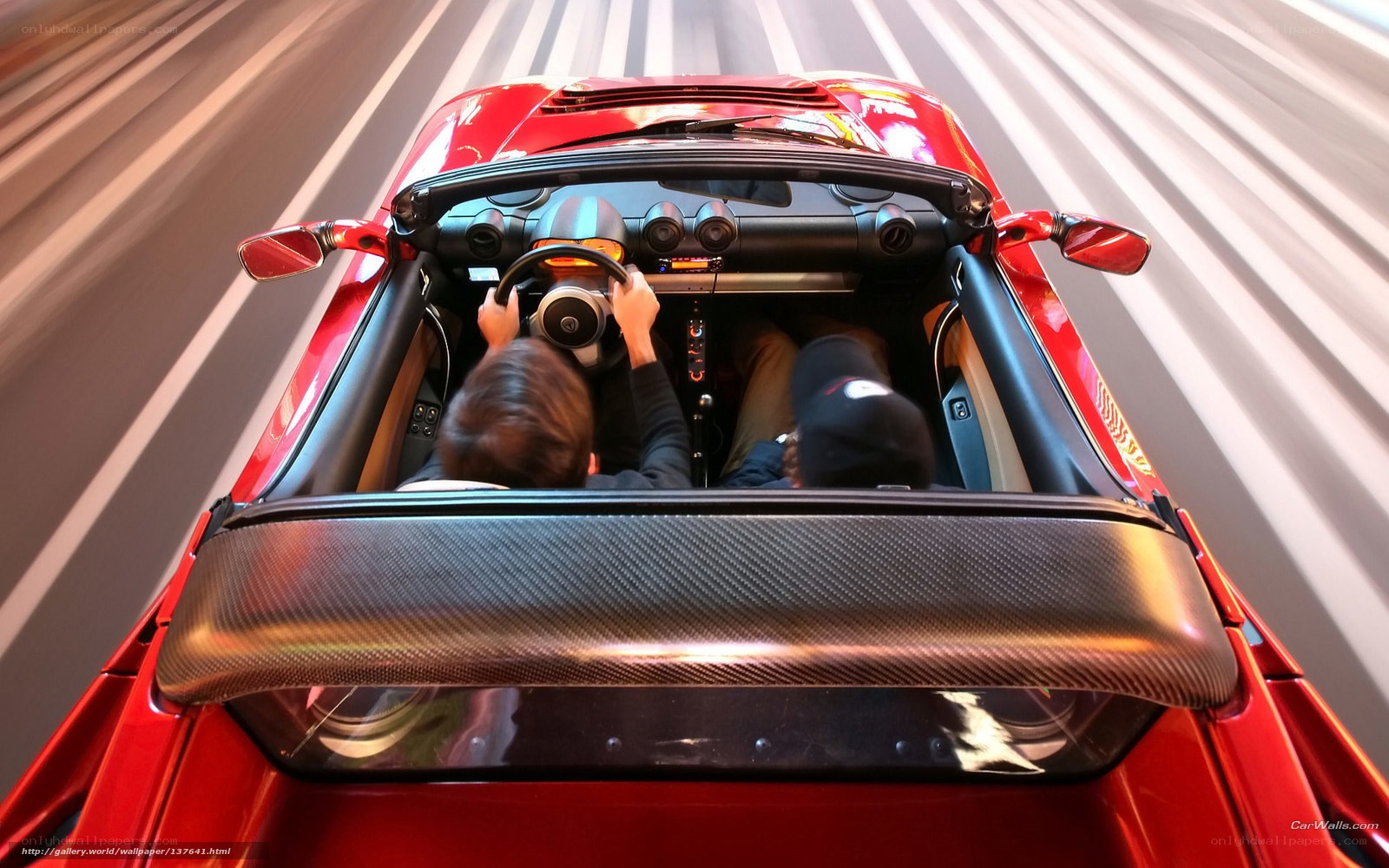 Red sports car driving fast