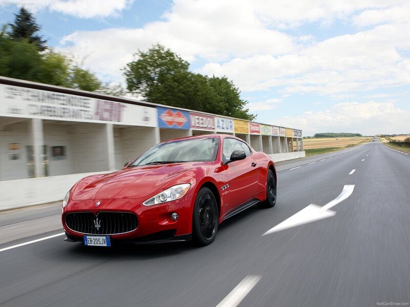 Red Sports Car — Dynamic, Afternoon, Photograph, Road, Building