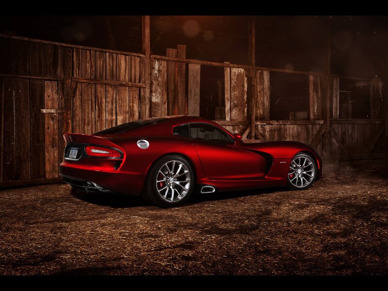 Red sports car in a barn
