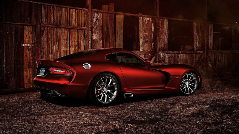 Red sports car in a barn