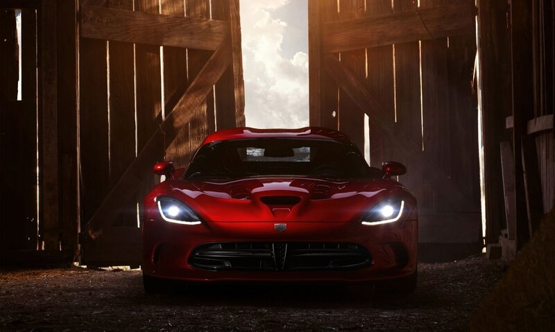 Red sports car in a barn