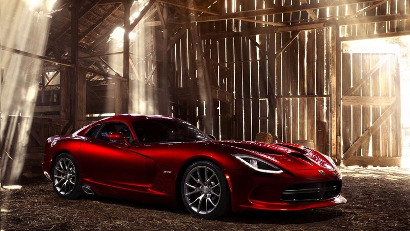 Red sports car in a barn