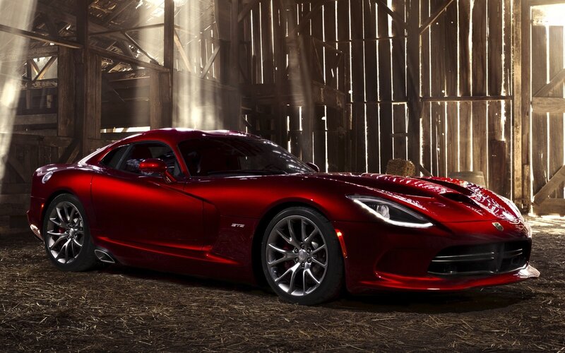 Red sports car in a barn