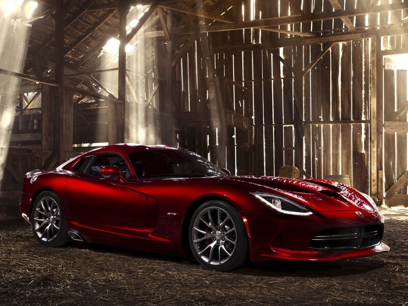 Red sports car in a barn