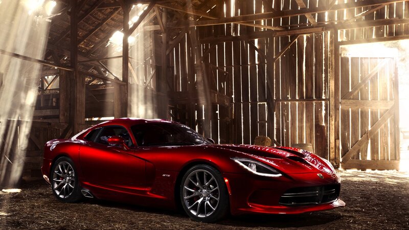Red sports car in a barn