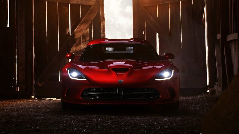 Red sports car in a barn