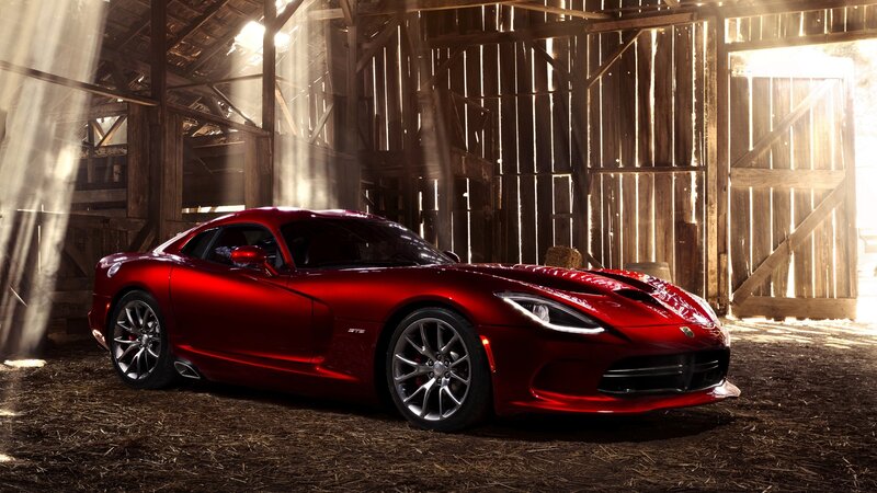 Red sports car in a barn