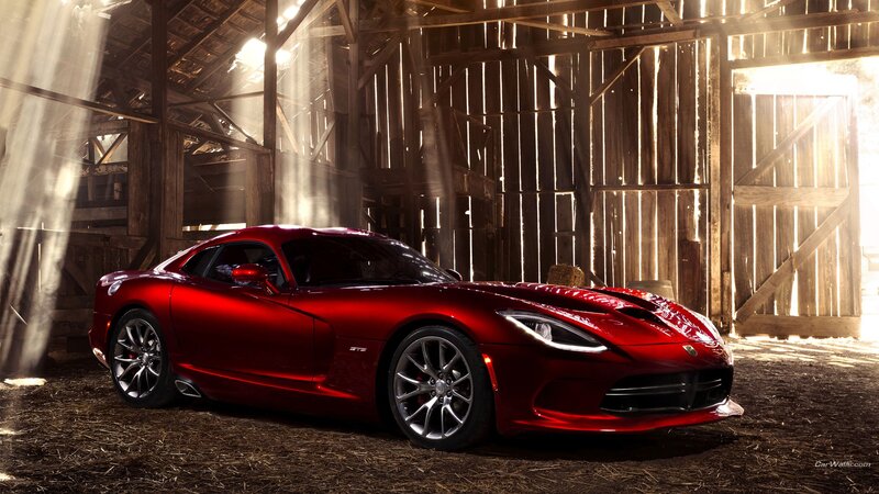 Red sports car in a barn