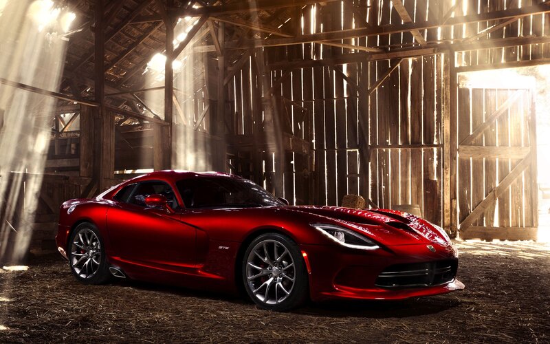 Red sports car in a barn