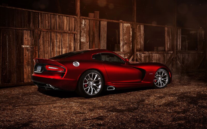 Red sports car in a barn