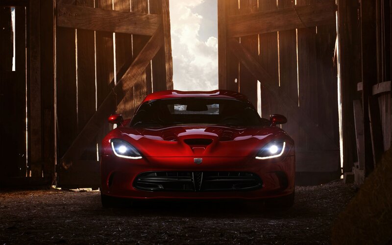 Red sports car in a barn