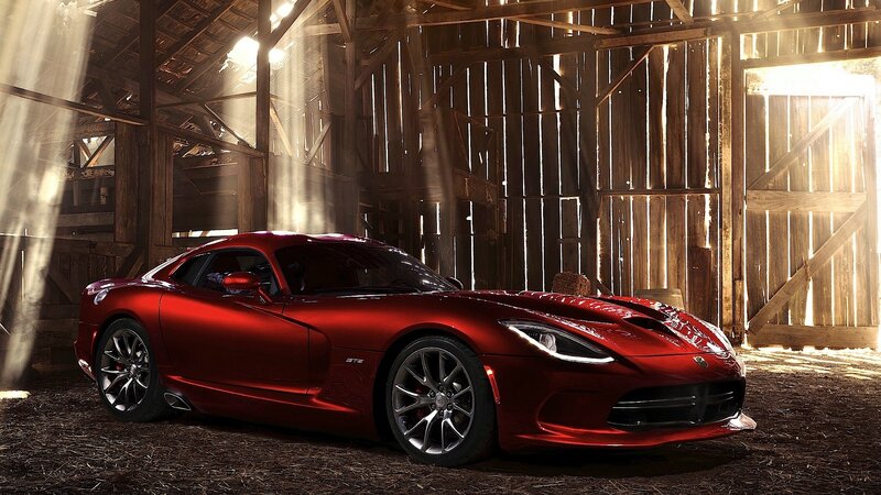 Red sports car in a barn