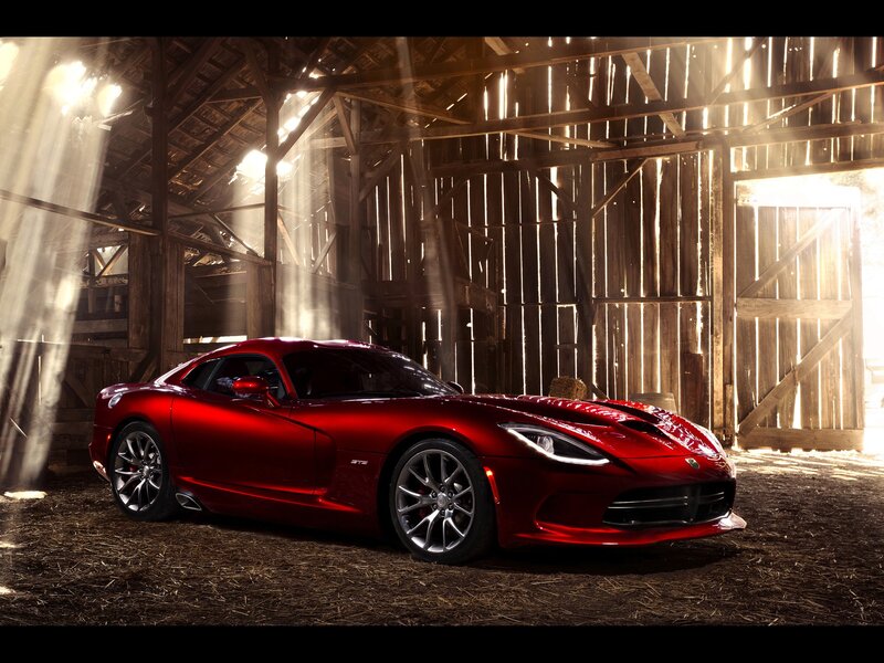 Red sports car in a barn