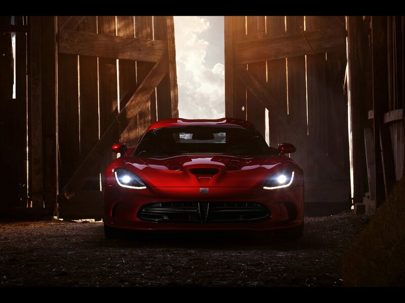Red sports car in a barn