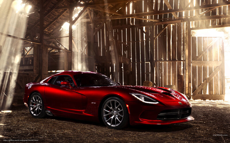 Red sports car in a barn