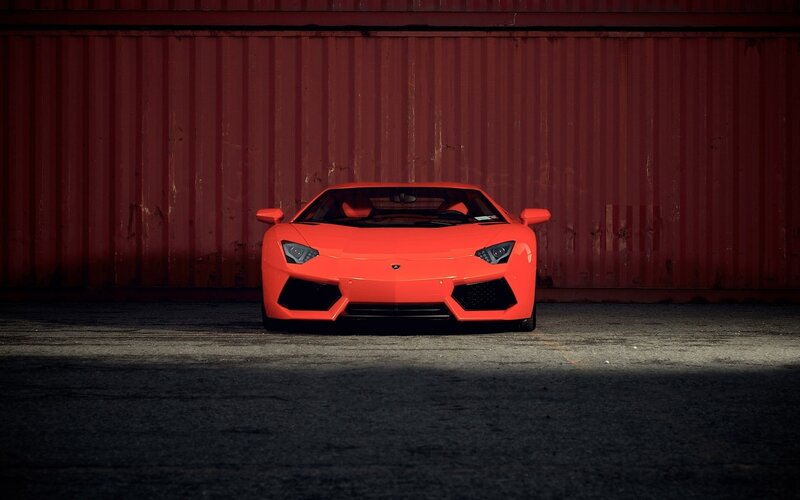 Red sports car in a garage