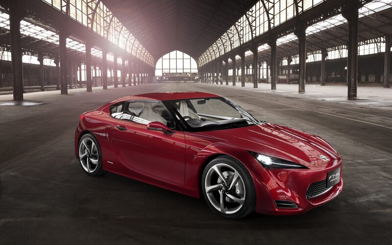 Red sports car in a warehouse