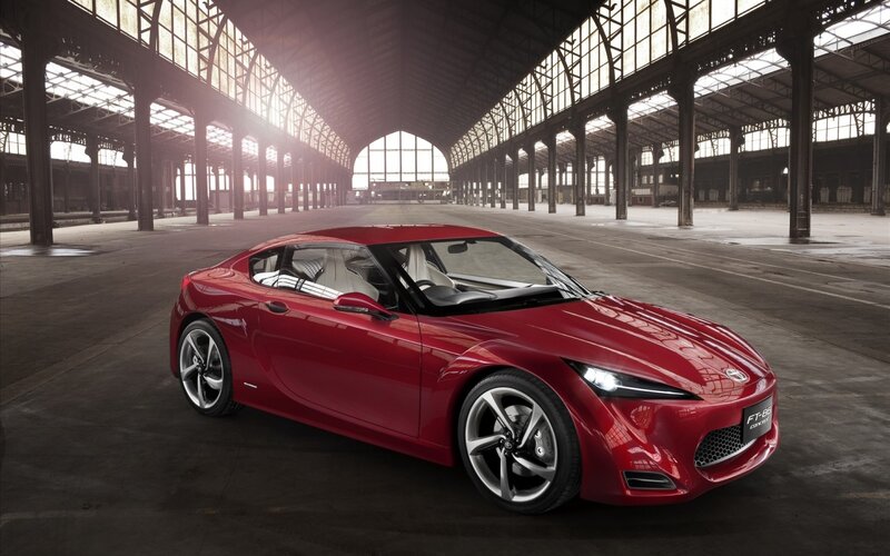 Red sports car in a warehouse
