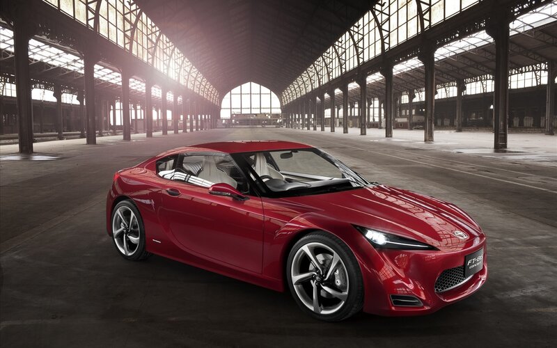 Red sports car in a warehouse