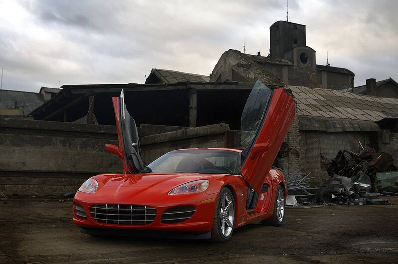 Red sports car in abandoned lot