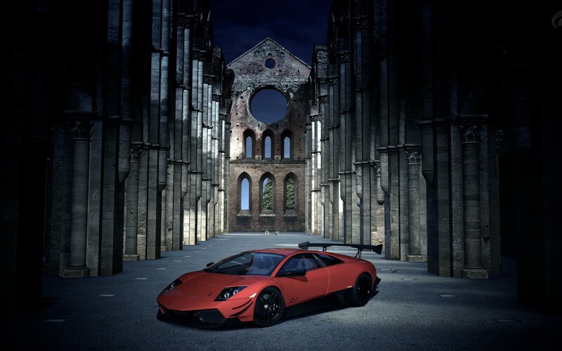 Red sports car in ancient ruins