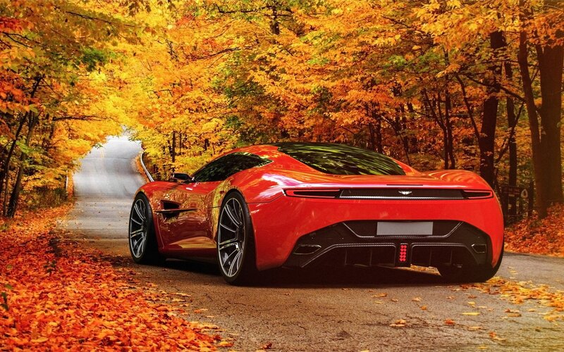 Red sports car in autumn forest