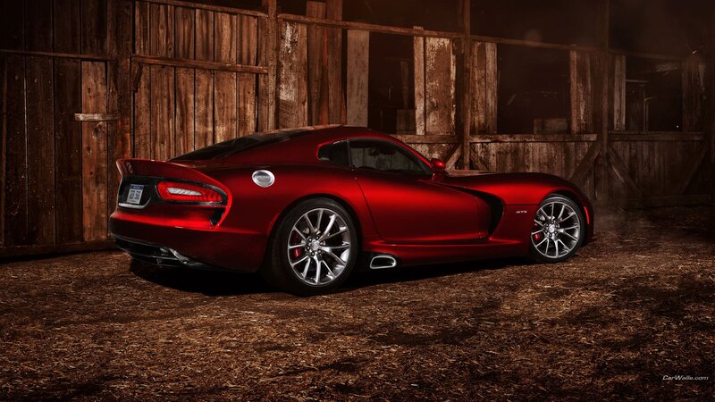 red sports car in barn