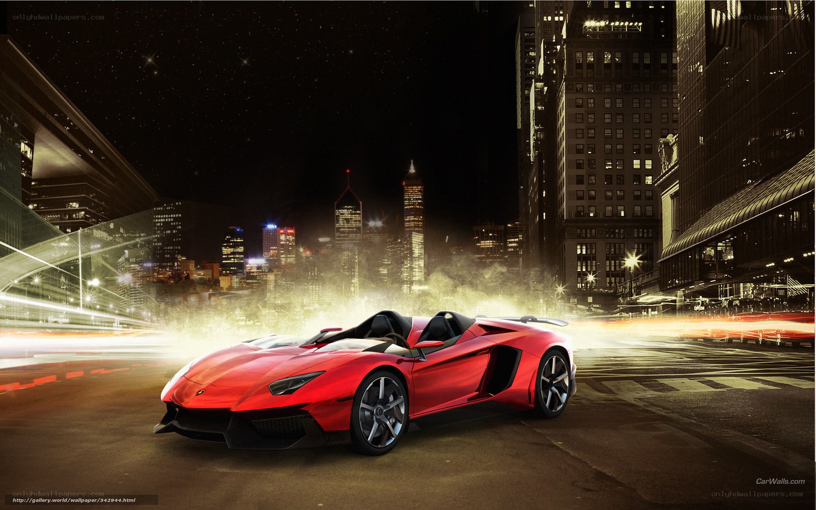 Red sports car in city at night