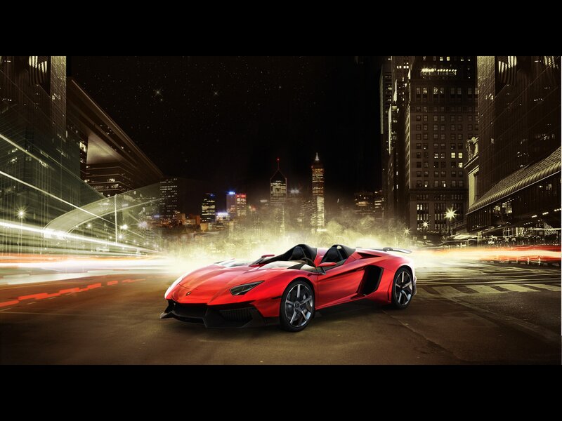 Red sports car in city at night