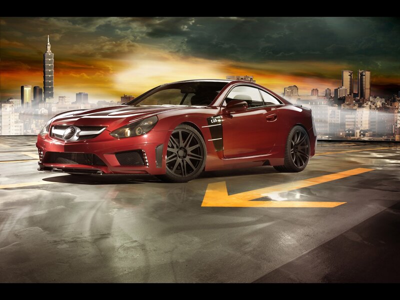 Red sports car in cityscape