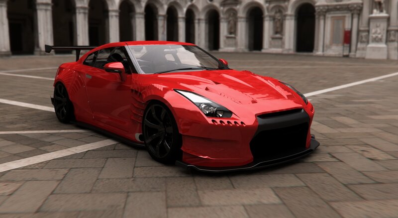 Red sports car in courtyard