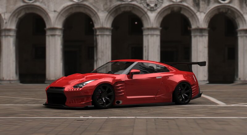 Red sports car in courtyard