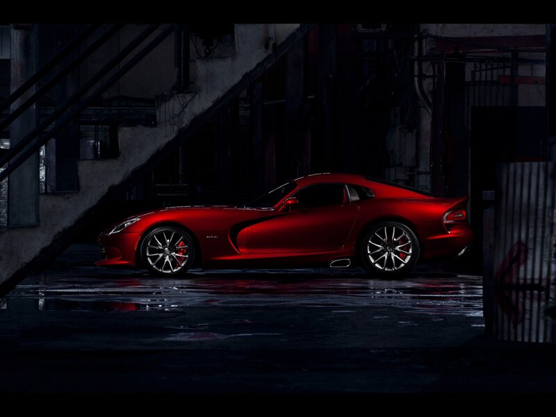 Red sports car in dark alley