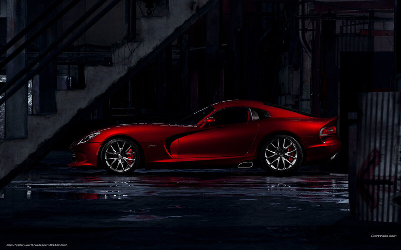 Red sports car in dark alley