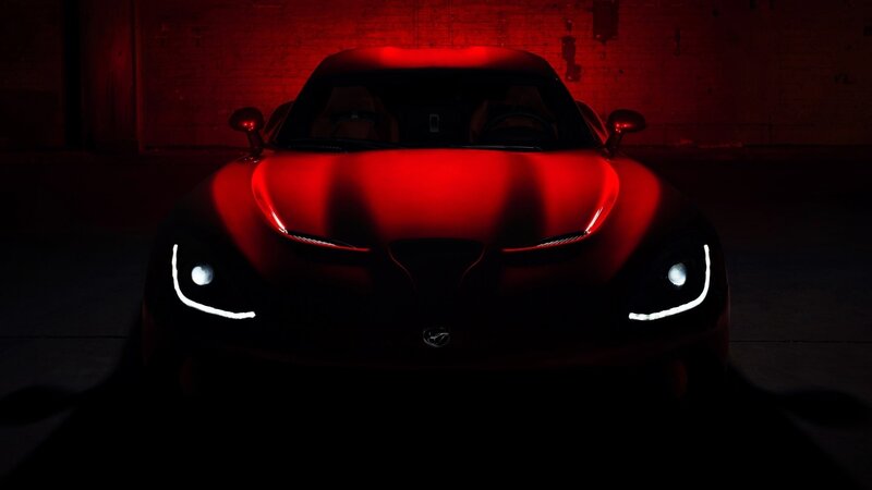 Red sports car in dark garage