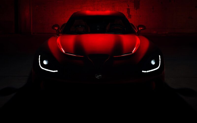 Red sports car in dark setting