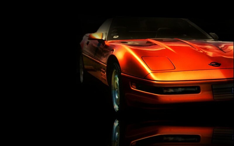 red sports car in dark setting