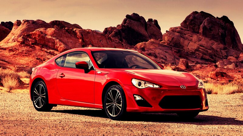 Red sports car in desert