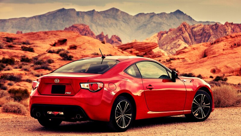 Red sports car in desert