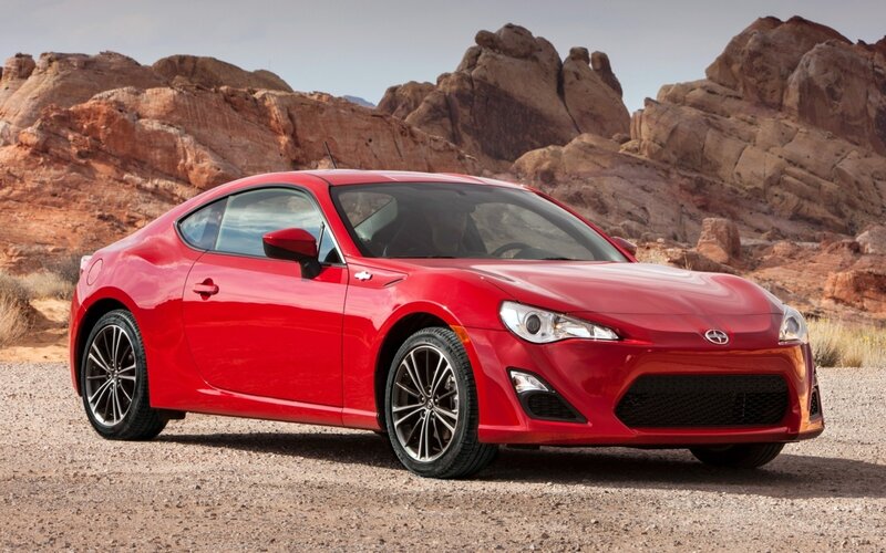 Red sports car in desert