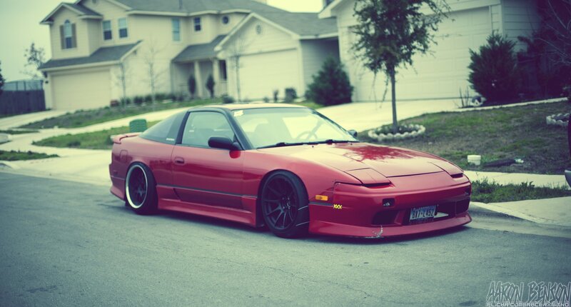 red sports car in driveway